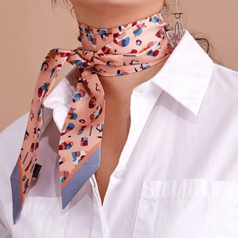 Orange Suzhou Museum Artifact Mulberry Silk Twilly styled as a wrapped neck scarf with a white shirt.