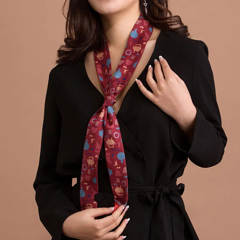 Woman wearing the red Suzhou Museum Artifact Print Mulberry Silk Twilly as a long neck scarf.