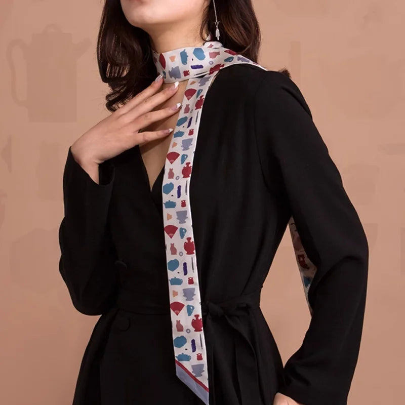 White Suzhou Museum Artifact Print Mulberry Silk Twilly styled around the neck with a black outfit.