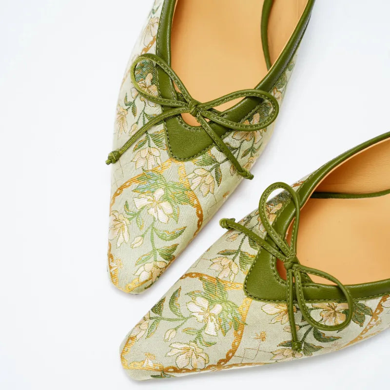 Close-up of Verdant Floral Dayun Brocade mules with delicate bow detail and traditional Chinese textile artistry.