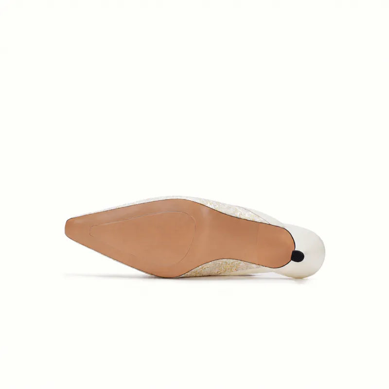 White Song Brocade kitten heel mules bottom view showing the pointed toe silhouette and elegant design.
