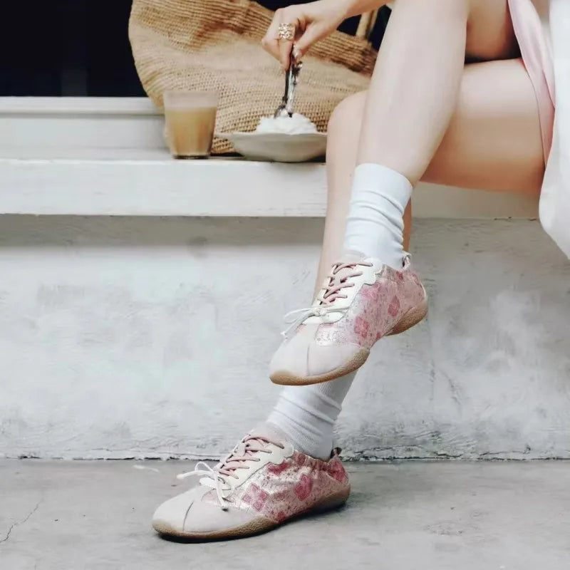 Woman wearing Shu Brocade ballet sneakers styled with a soft feminine outfit for everyday fashion.