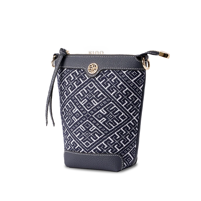 Side profile of Zhuang Brocade bucket crossbody bag, highlighting tapered silhouette (17cm top width × 10cm base width) and side embroidery details.