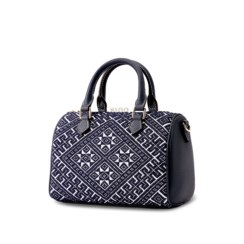 Side view of Zhuang Brocade Flying Swallow Tote Bag, displaying its structured silhouette.