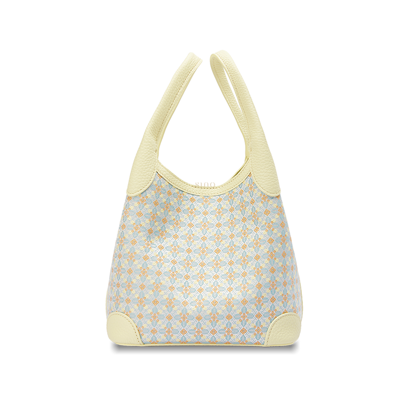 Front view of the Luxury Zhuang Brocade Osmanthus Motif Leather Basket Tote Bag, featuring a pale yellow leather trim and a woven geometric osmanthus-inspired brocade pattern.