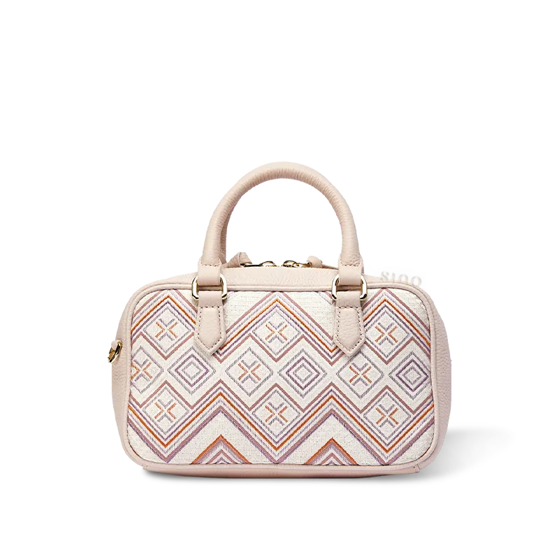 Pink geometric Zhuang brocade Boston bag with leather handles.
